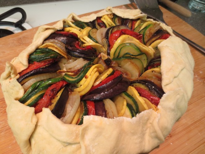 Before baking! Ratatouille Galette. Don't make the mistake I did. Assemble directly on a parchment lined baking sheet NOT a cutting board.  